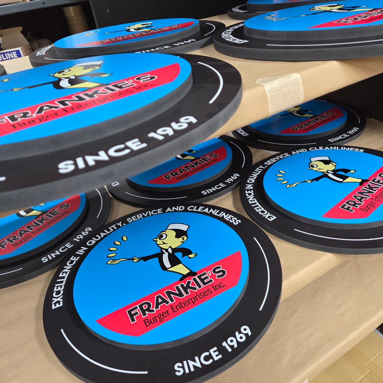 Frankie's Burger Enterprises layered logo signs in production